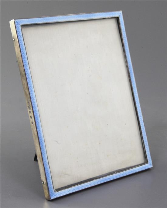 An early 1930s silver and blue guilloche enamel mounted rectangular photograph frame by William Comyns & Sons Ltd, 17.3cm.
